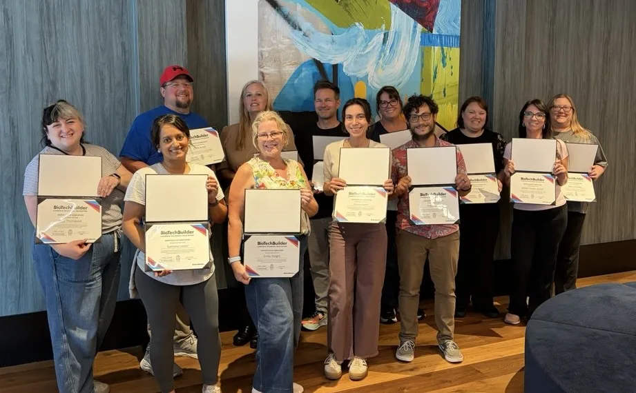 Group photo of educators holding certificates